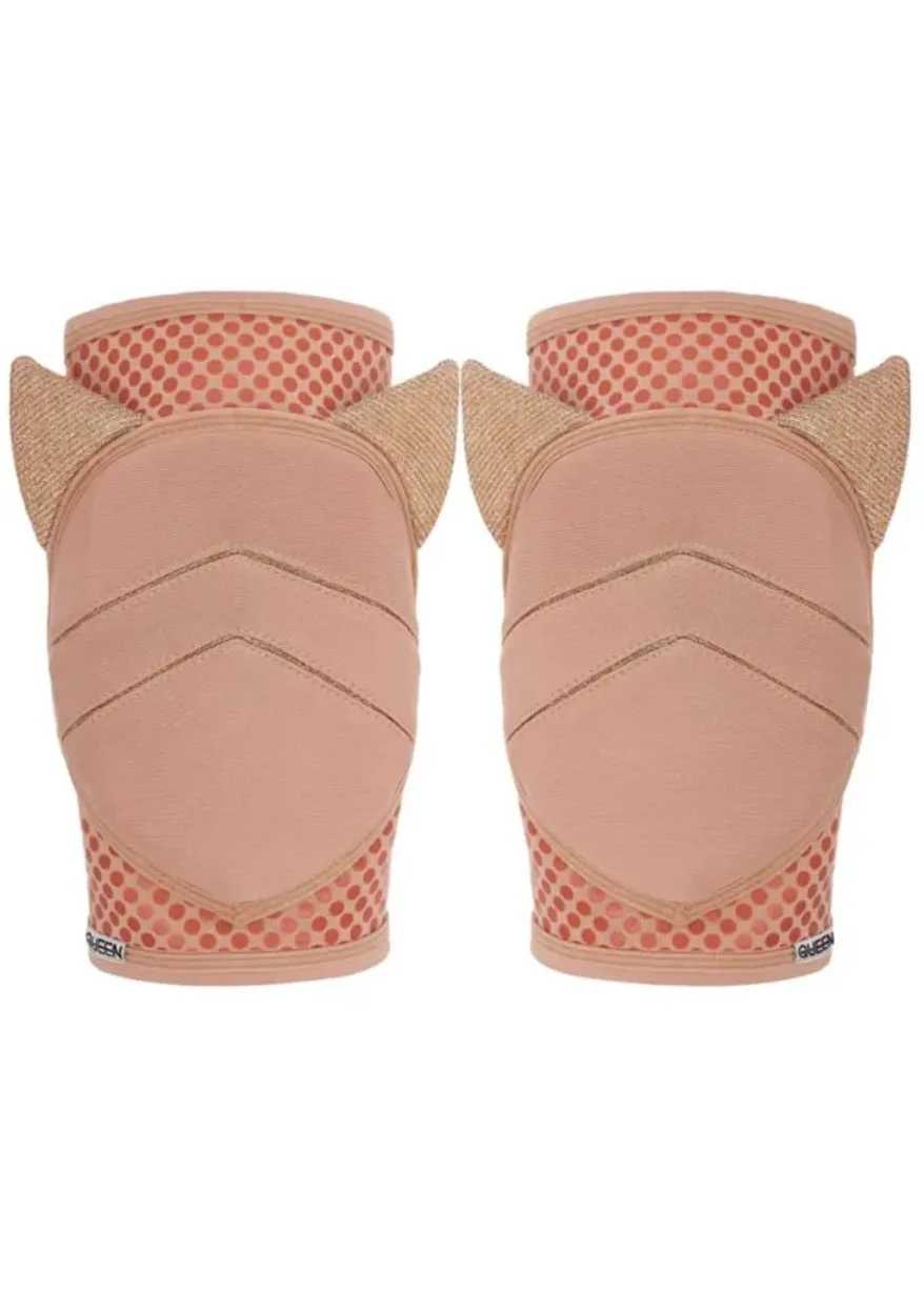 Pair of pink knee pads with protective shell and dotted fabric lining, shown from the back (side-by-side).