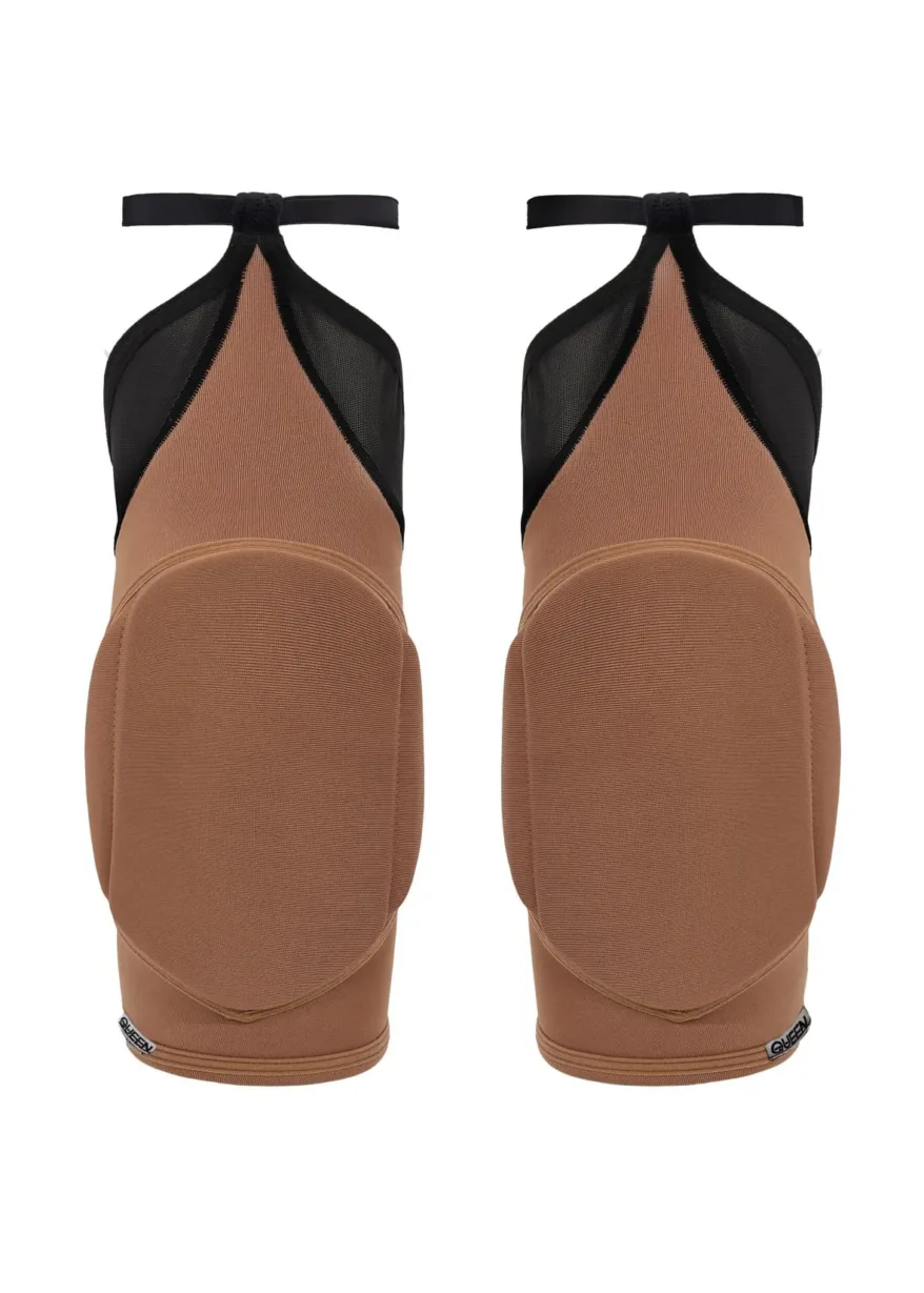 Pair of tan ballet flats with black mesh panels and ankle straps, shown from the back