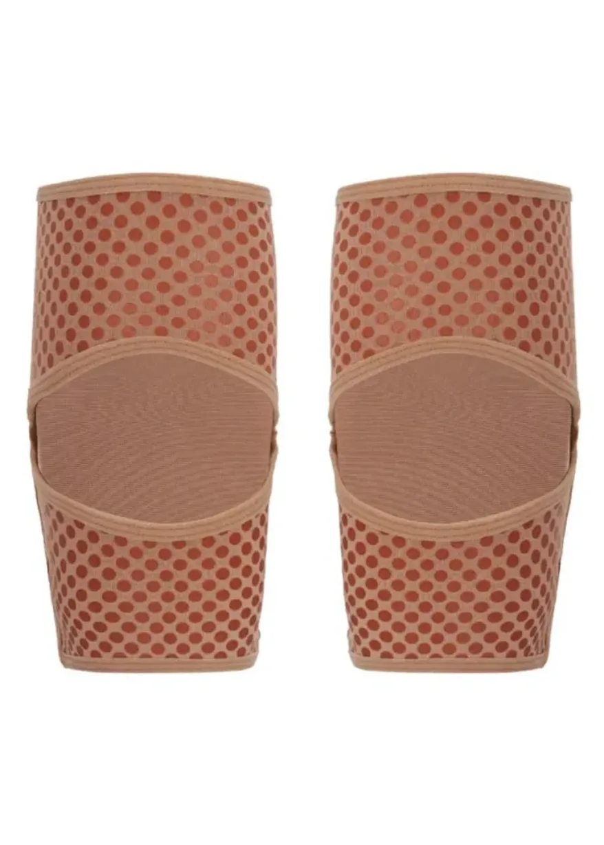 Pair of pink perforated slip-on wedge sandals with a wide strap over the top of the foot