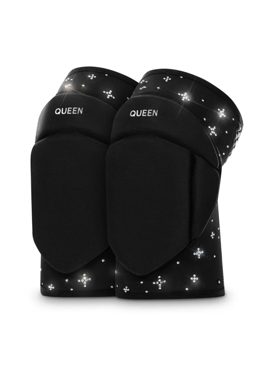 Close-up of black knee-high boots with crystal studs and the word QUEEN on the strap near the top edge.